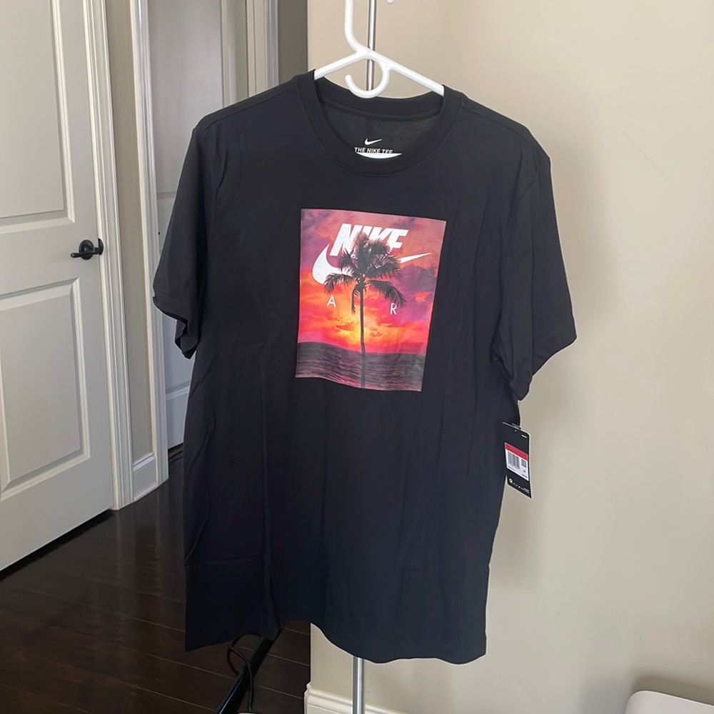 The Nike Tee. Black with pictured design. NWT, size: LG